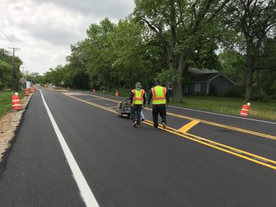 Village of Long Grove roads being striped with yellow lines