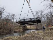Robert Parker Coffin Bridge being lifted up and moved to another site. 